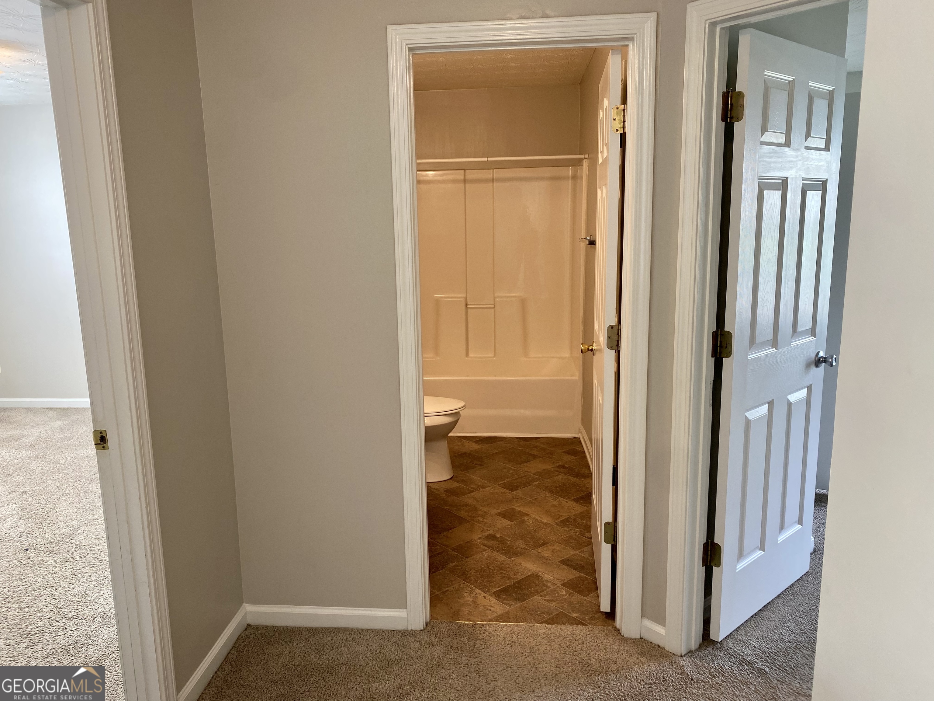 456 Parkside Way McDonough, GA 30253 - Photo 12 of 14 an empty room with wooden door
