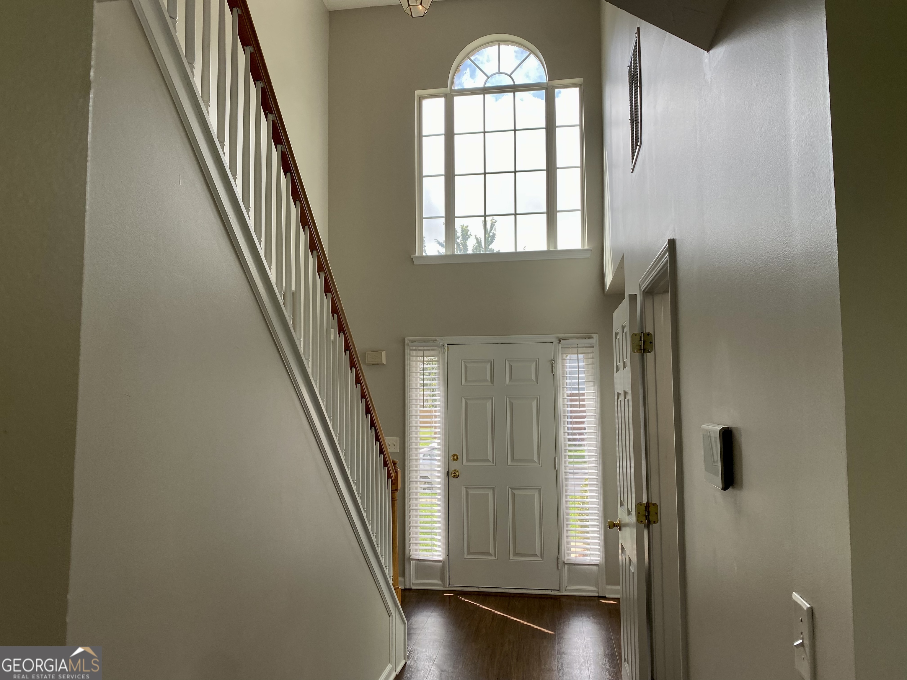 456 Parkside Way McDonough, GA 30253 - Photo 2 of 14 wooden floor in an empty room with a window