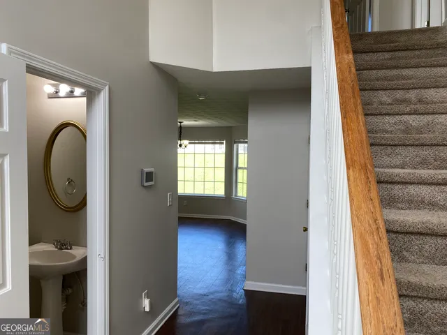 a view of a livingroom with furniture and a window