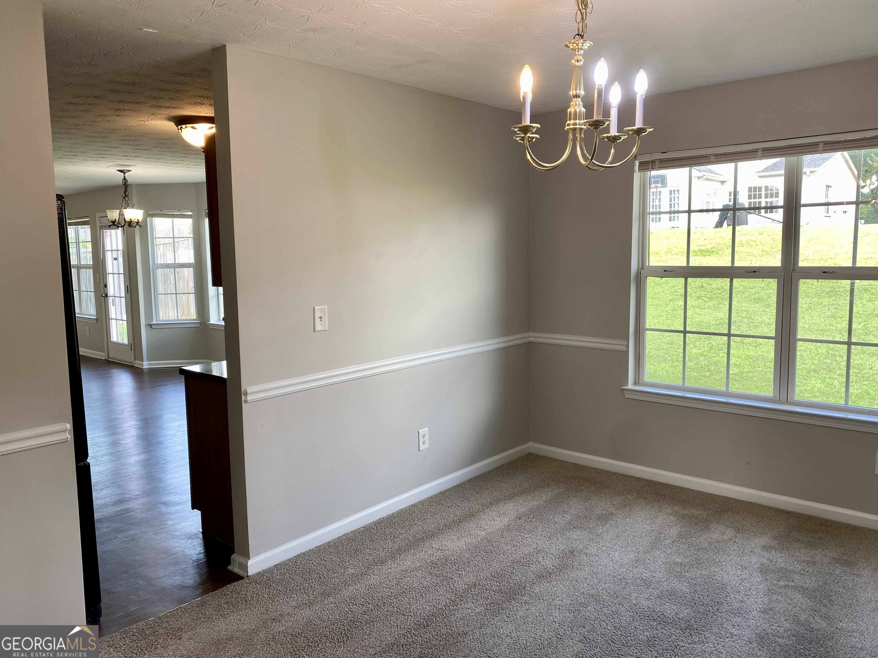 456 Parkside Way McDonough, GA 30253 - Photo 6 of 14 wooden floor in an empty room with a window