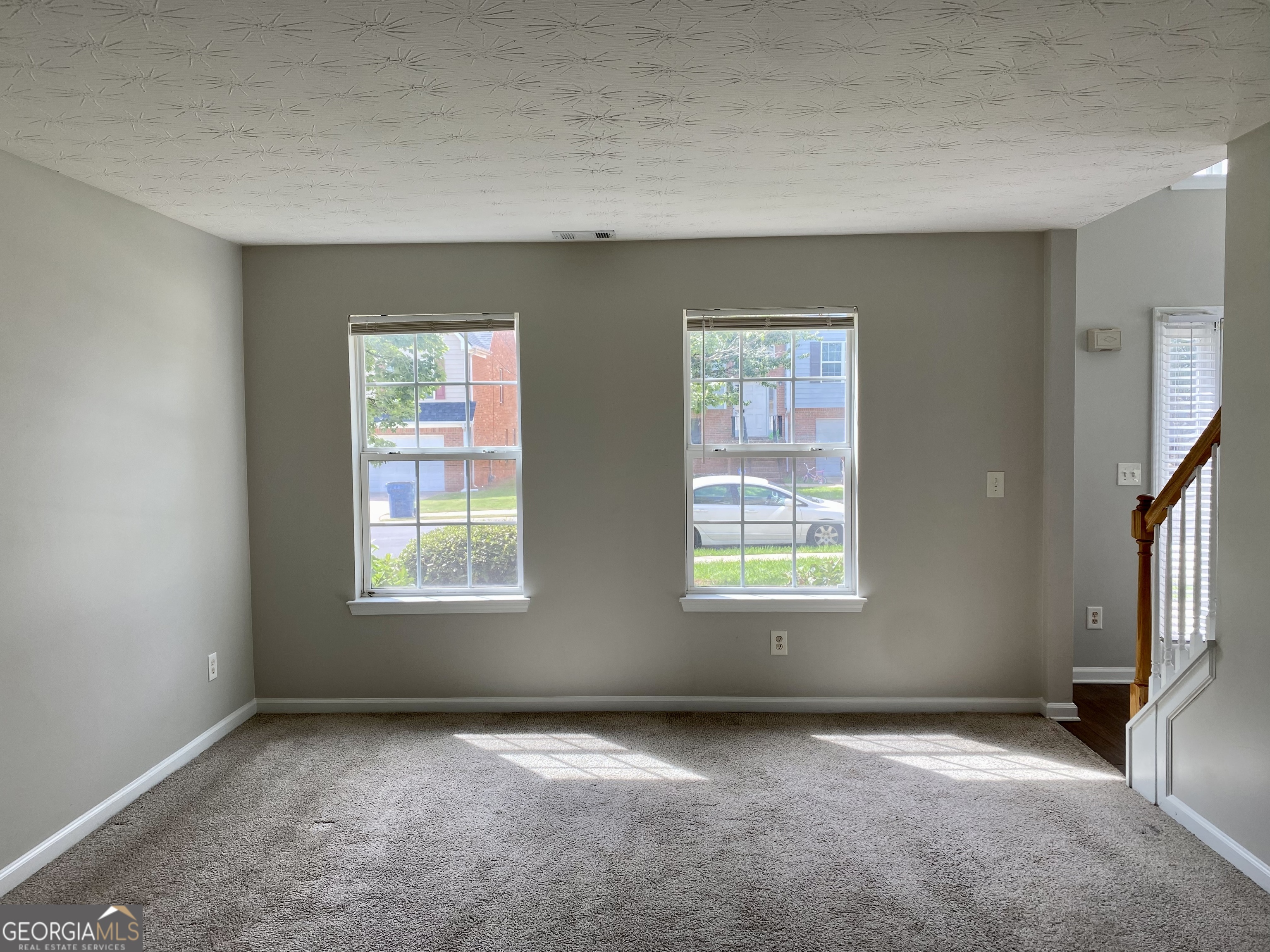 456 Parkside Way McDonough, GA 30253 - Photo 9 of 14 an empty room with windows