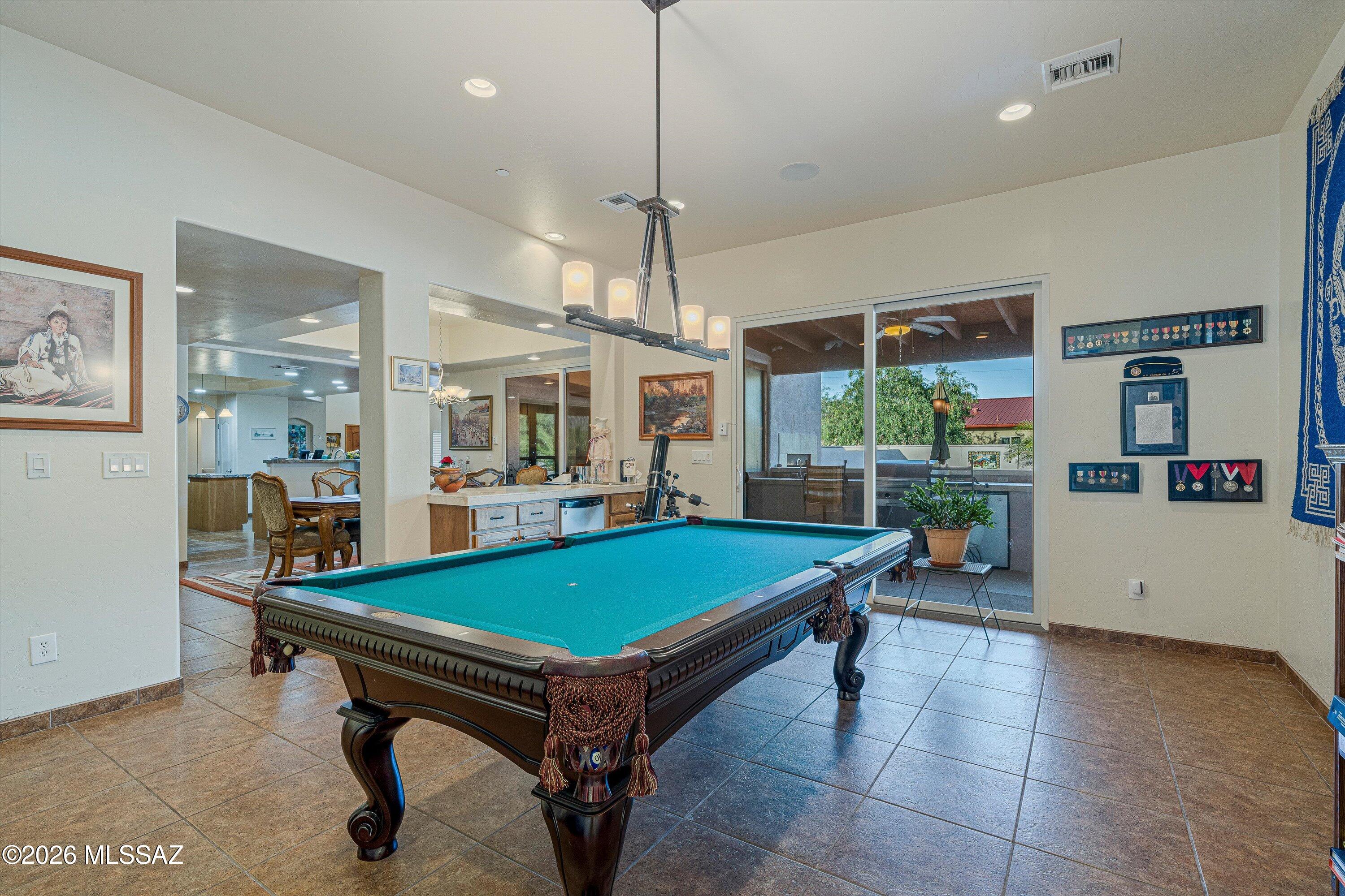 4677 East Rail N Road Tucson, AZ 85739 - Photo 23 of 48 Recreation room with patio door to backyard oasis