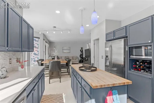 a kitchen with a sink stove and refrigerator