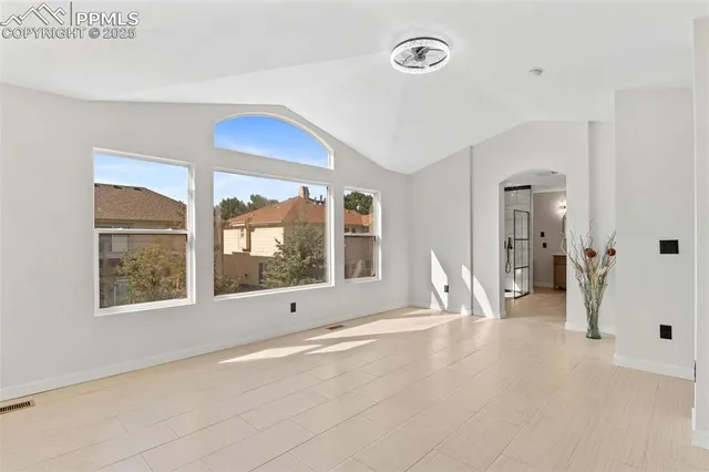 a view of an empty room with a window