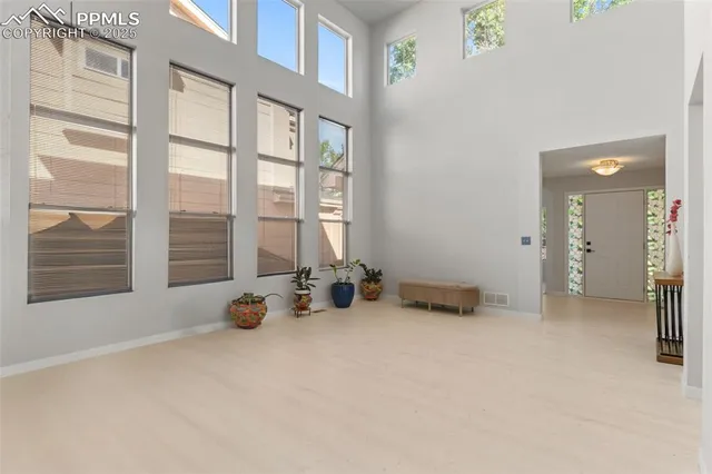 a view of room with furniture and windows