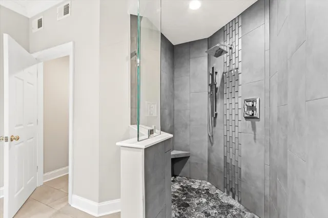 a bathroom with a shower toilet and a shower