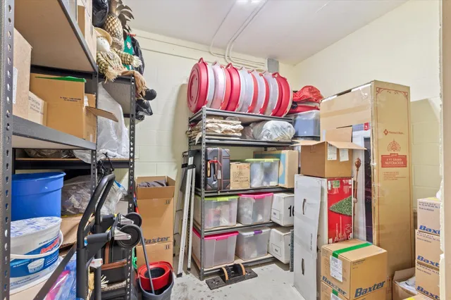 an aerial view of a houses with a lake
