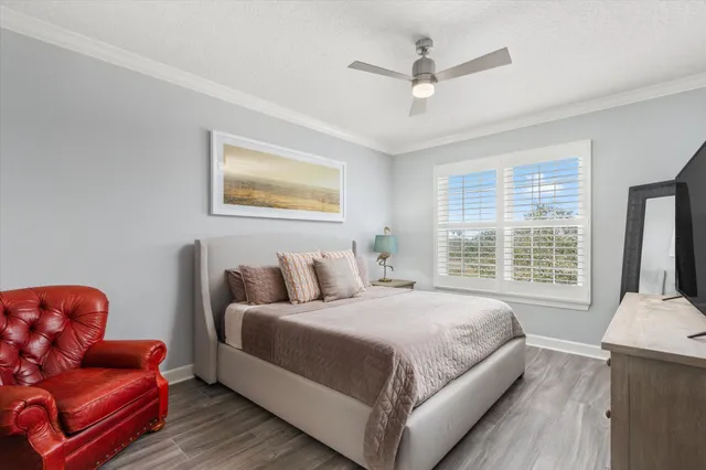 a bedroom with a bed couch and window