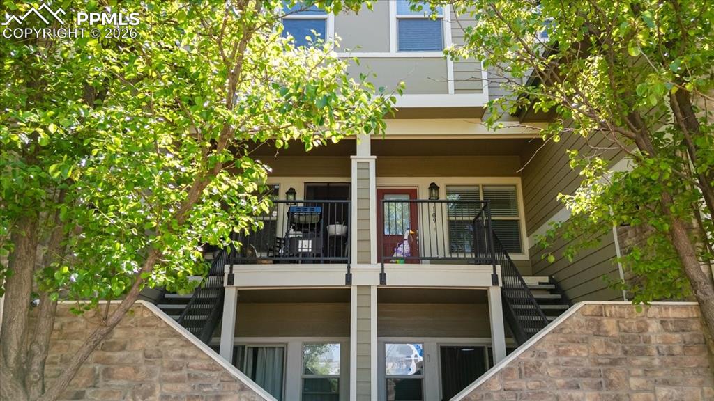5800 Tower Road, Unit 108 Denver, CO 80249 - Photo 2 of 35 Multi-story exterior with horizontal siding and stone veneer accents