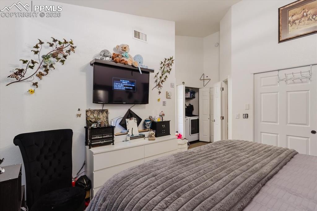 5800 Tower Road, Unit 108 Denver, CO 80249 - Photo 28 of 35 Interior room featuring white walls and high ceilings