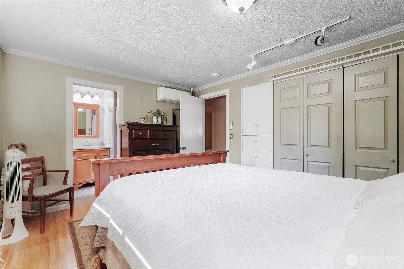 2120 Seaview Street West University Place, WA 98466 - Photo 15 of 33 a bedroom with a large bed and wooden floor