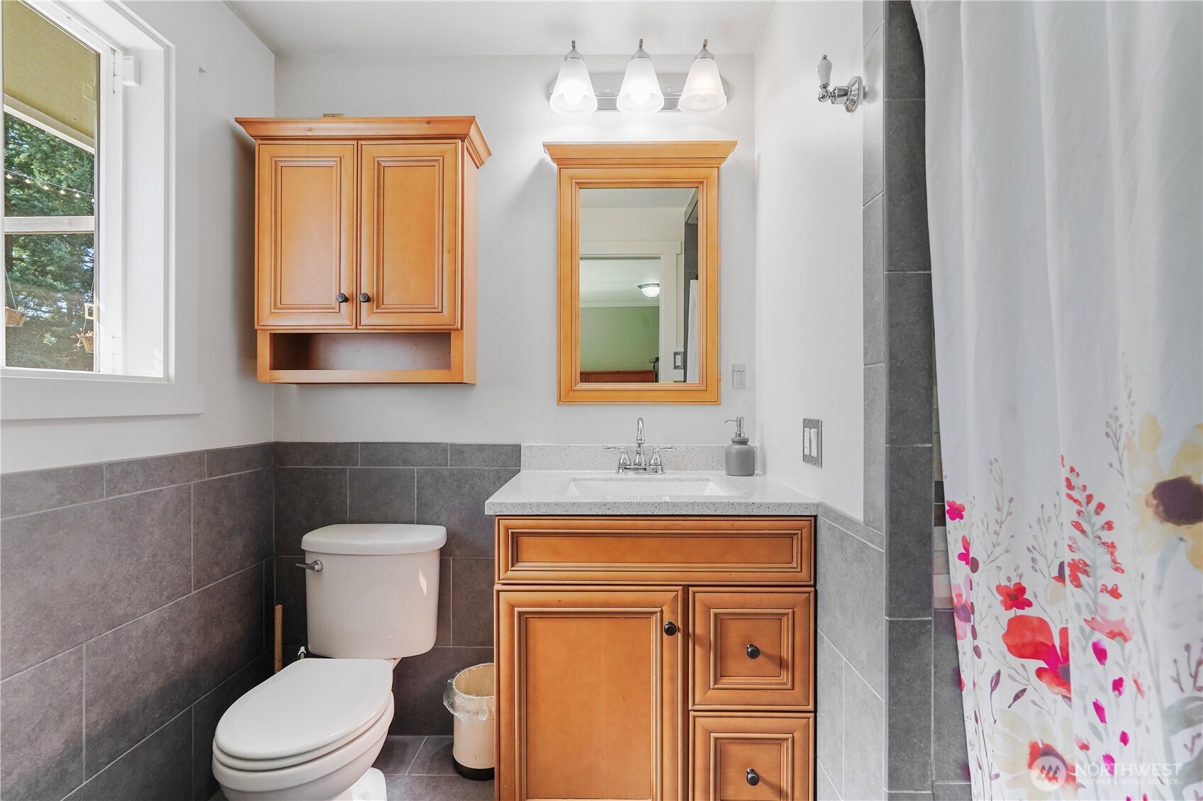 2120 Seaview Street West University Place, WA 98466 - Photo 16 of 33 a bathroom with a toilet sink and mirror