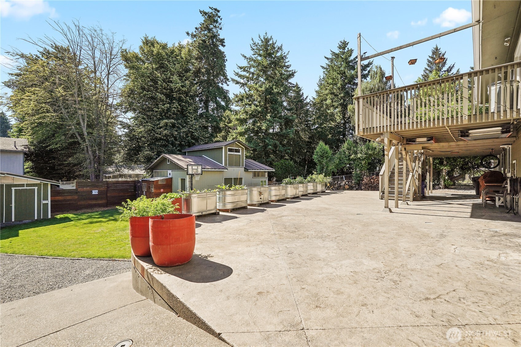2120 Seaview Street West University Place, WA 98466 - Photo 29 of 33 a view of a patio with table and chairs potted plants with wooden fence