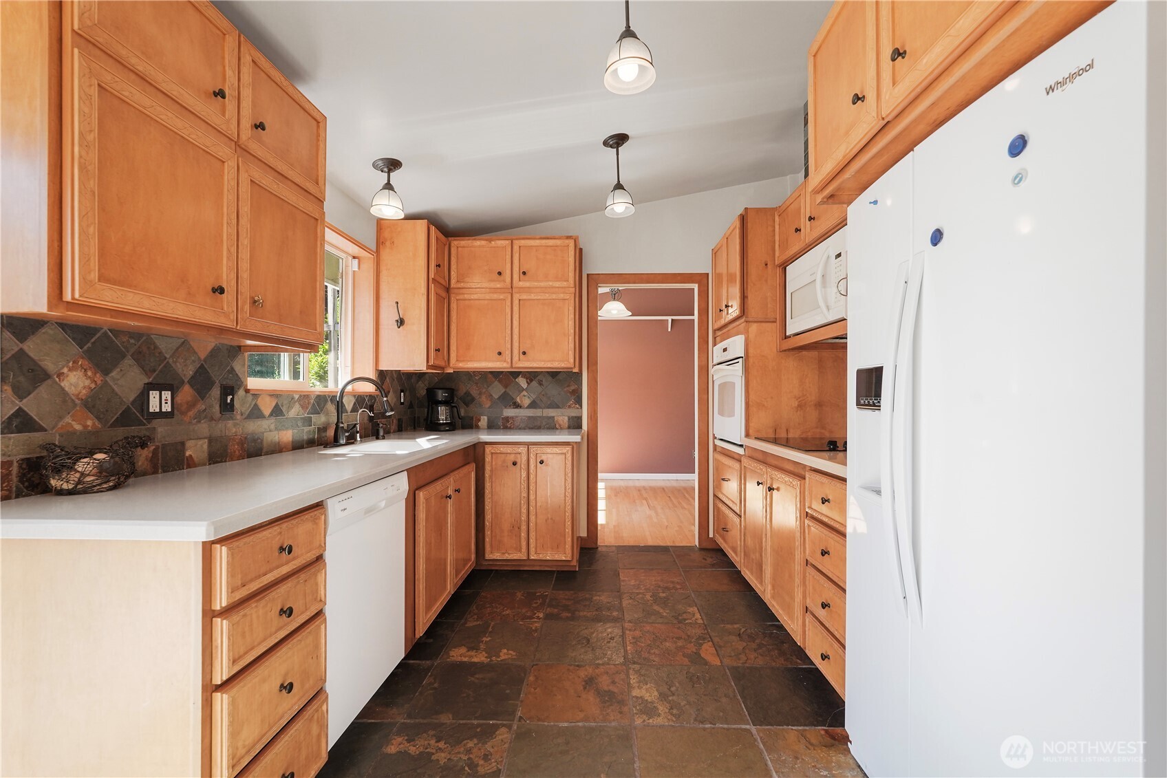2120 Seaview Street West University Place, WA 98466 - Photo 5 of 33 a kitchen with stainless steel appliances granite countertop a refrigerator and a stove