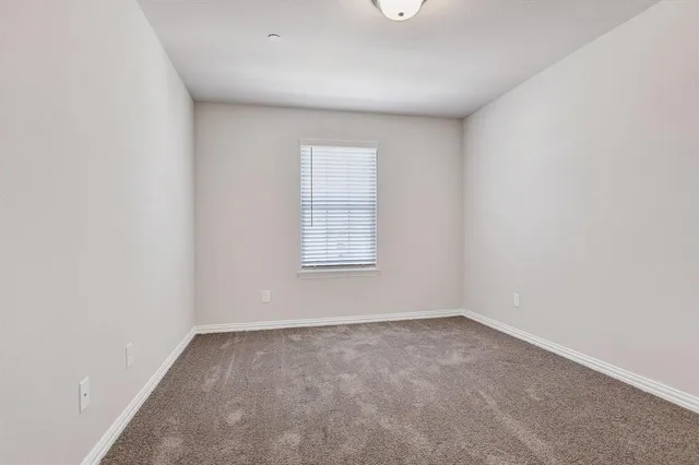 a bath tub sitting next to a white toilet