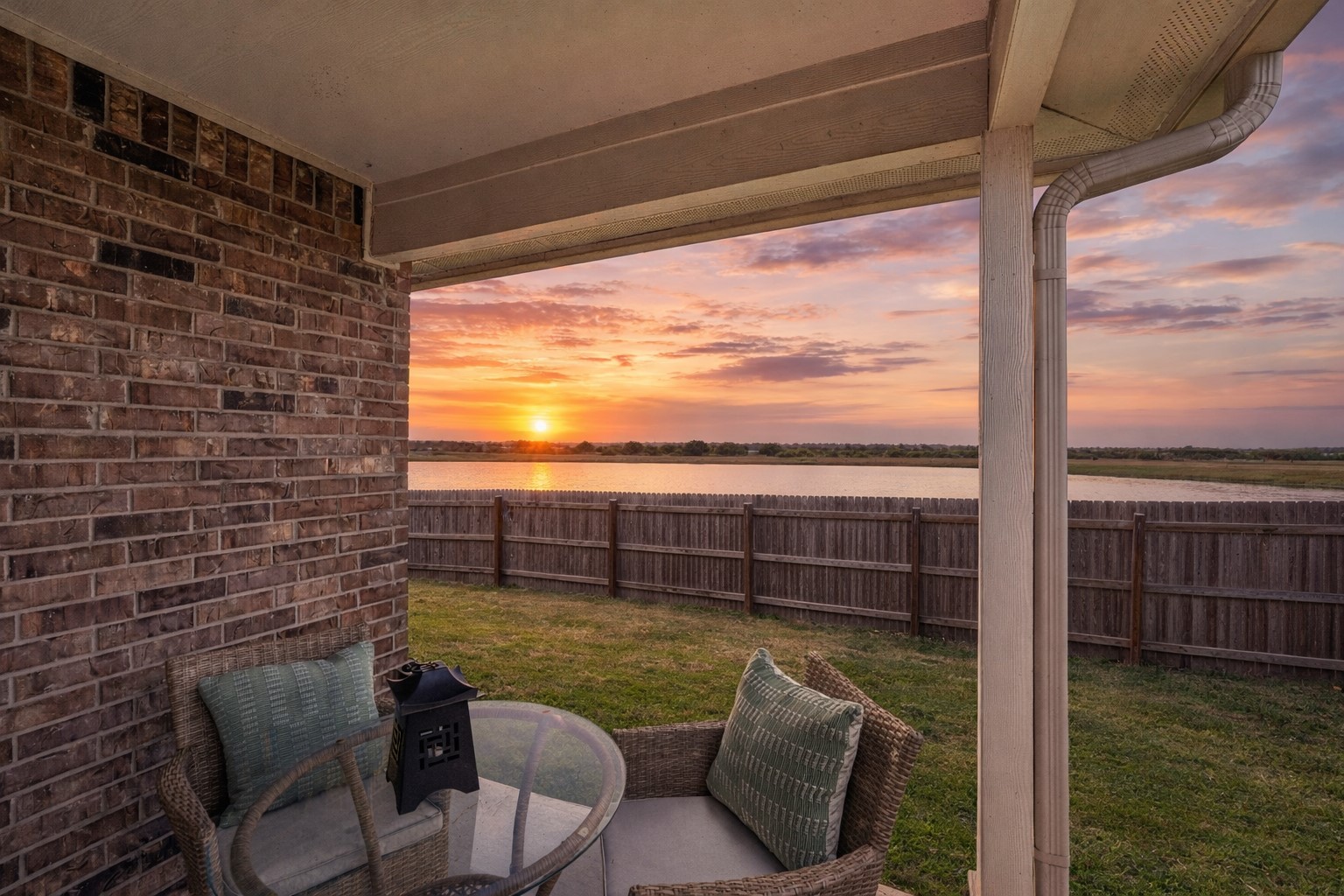 210 Helen Road Hutto, TX 78634 - Photo 3 of 20 a view of a balcony with table and chairs and wooden floor
