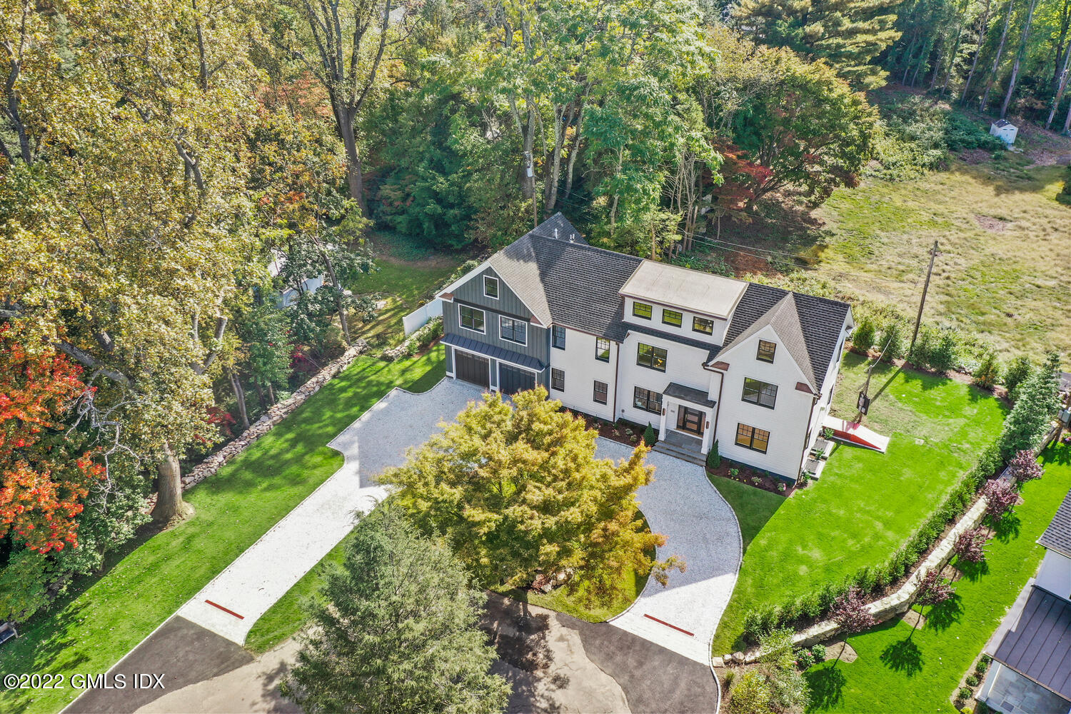 an aerial view of a house with a yard