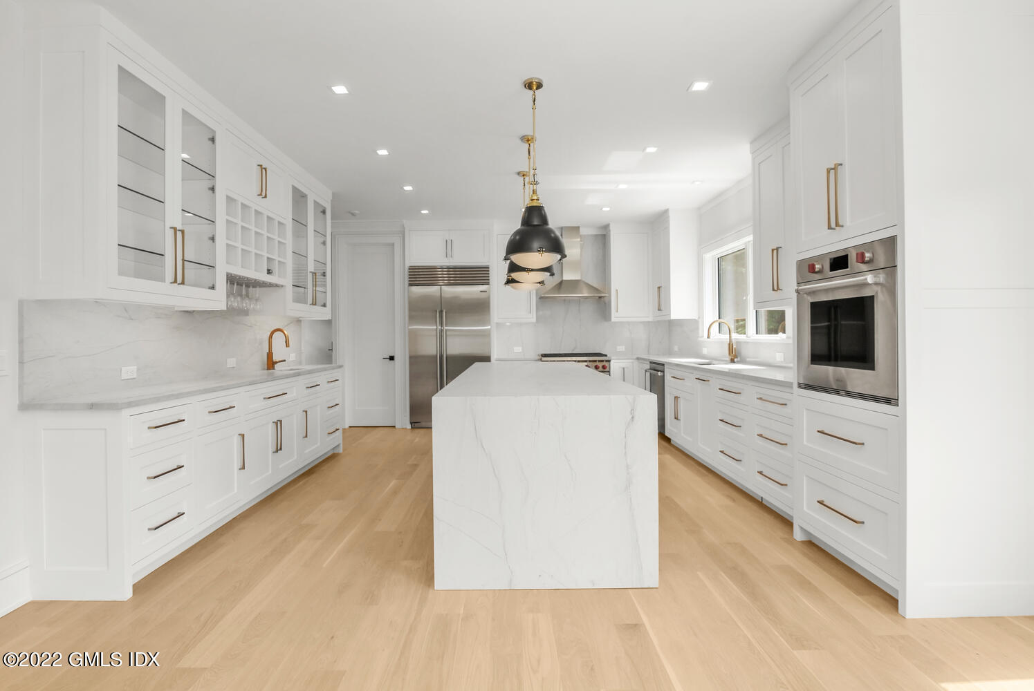 106 Sheep Hill Road Riverside, CT 06878 - Photo 14 of 53 a large white kitchen with cabinets