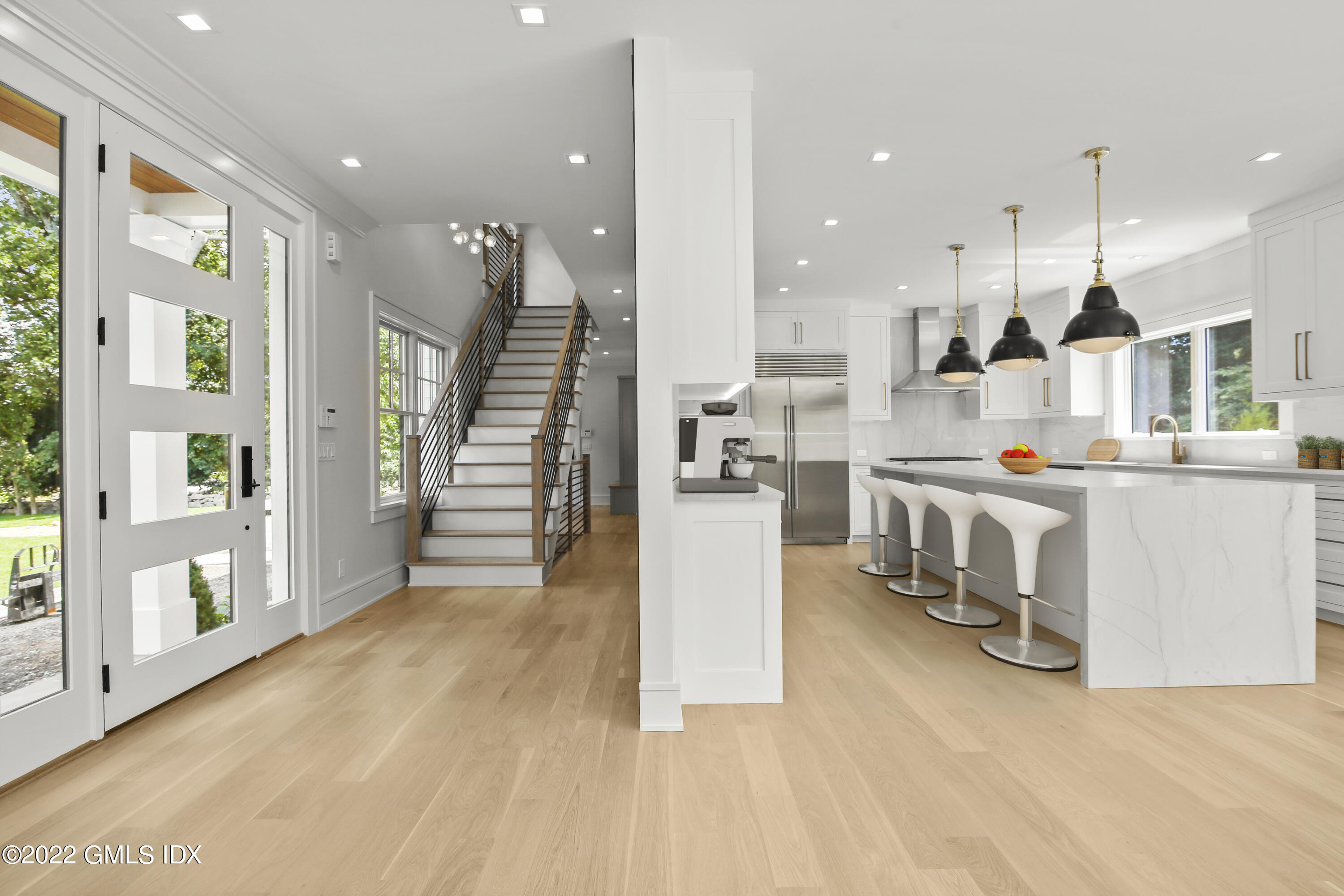 106 Sheep Hill Road Riverside, CT 06878 - Photo 16 of 53 a kitchen with stainless steel appliances kitchen island granite countertop a refrigerator a stove and a wooden floors