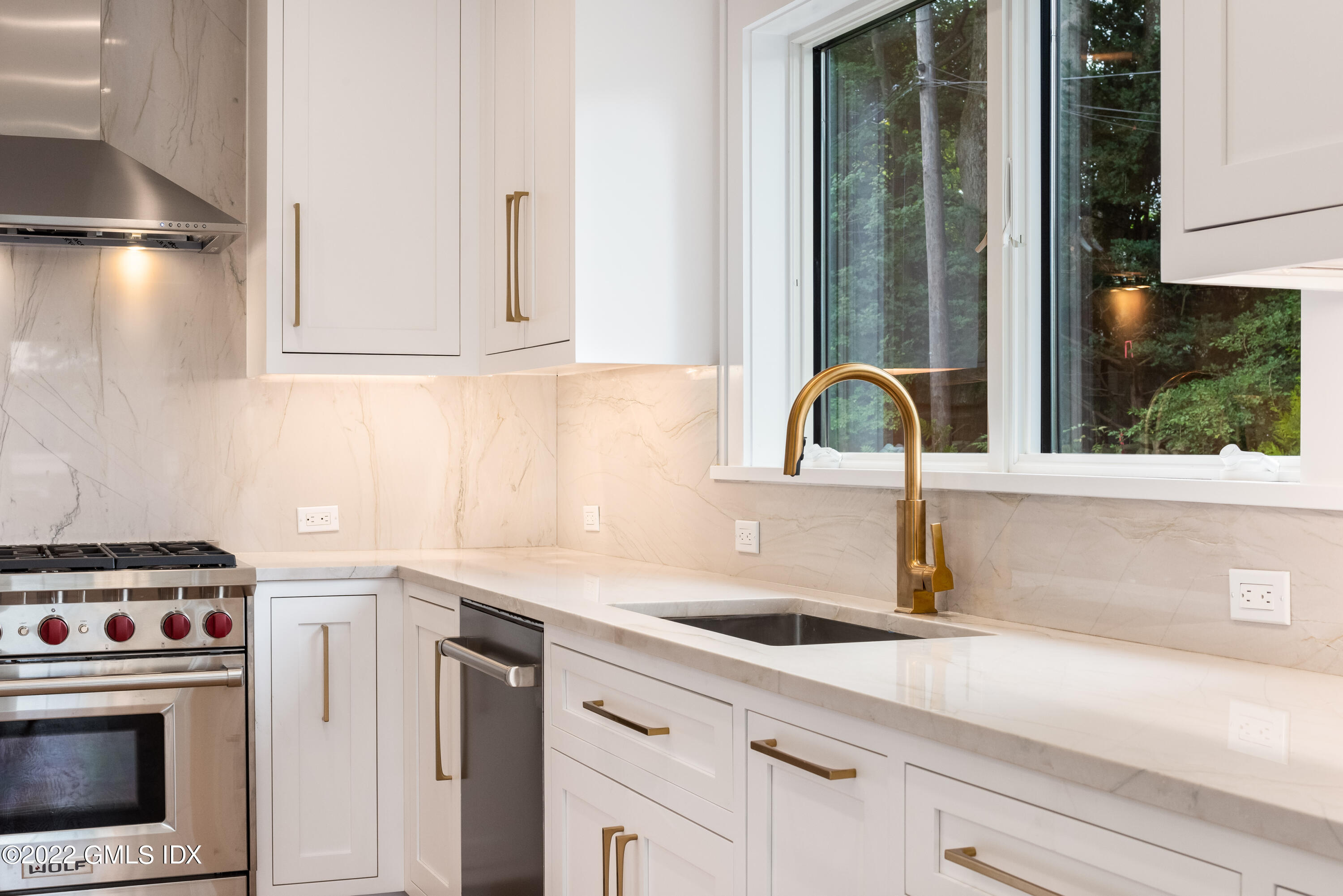 106 Sheep Hill Road Riverside, CT 06878 - Photo 19 of 53 a kitchen with a sink and a stove top oven