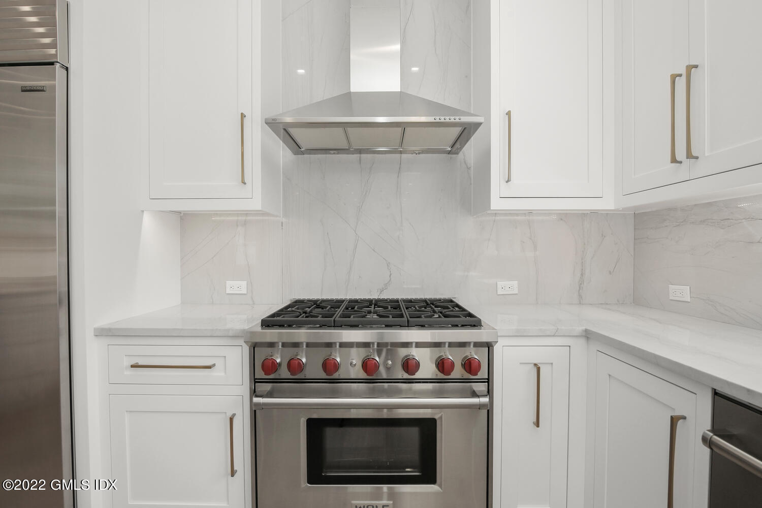 106 Sheep Hill Road Riverside, CT 06878 - Photo 20 of 53 a stove top oven sitting inside of a kitchen