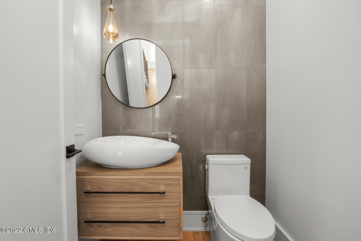 106 Sheep Hill Road Riverside, CT 06878 - Photo 24 of 53 a bathroom with a toilet a sink and mirror