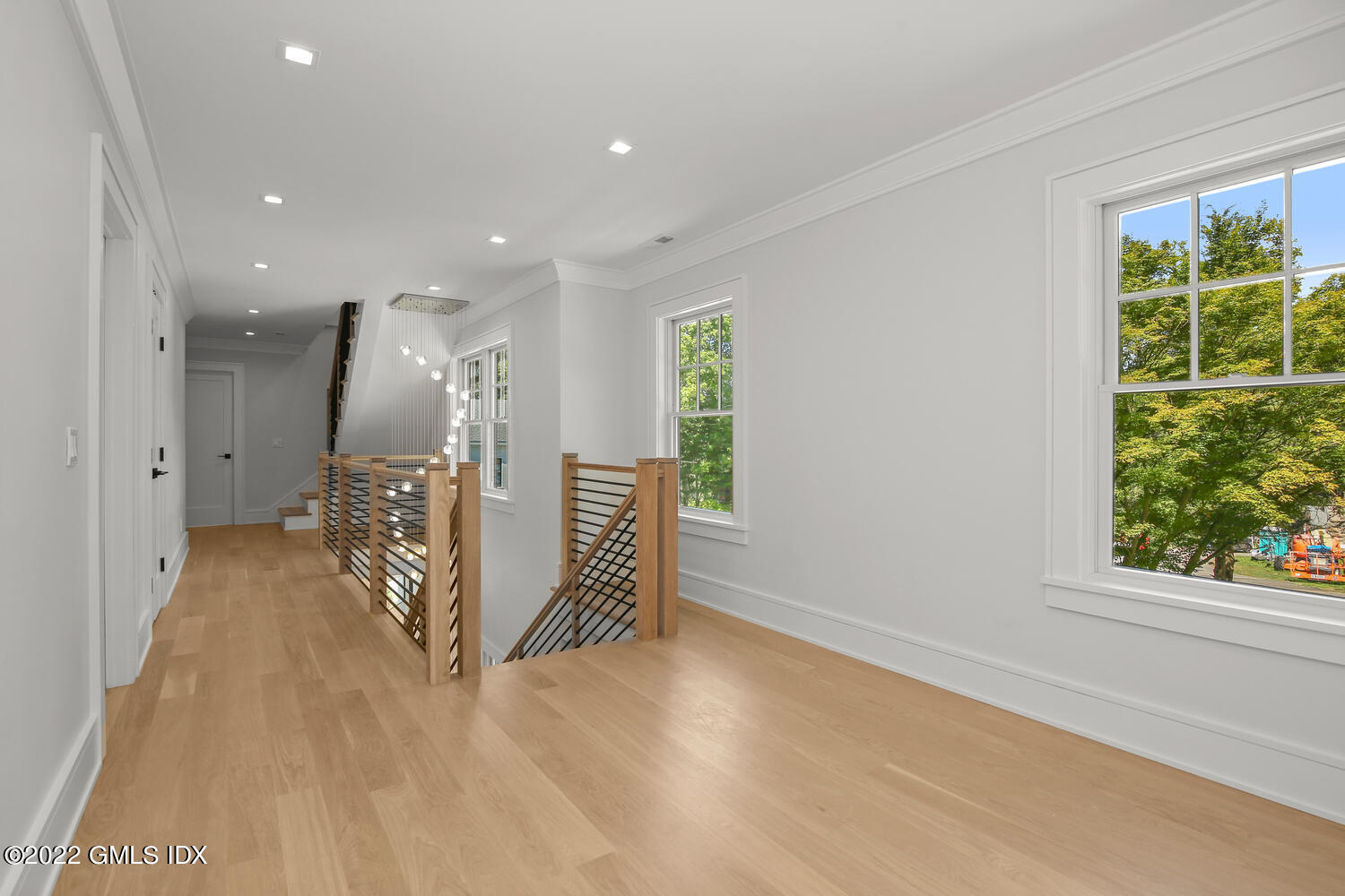 106 Sheep Hill Road Riverside, CT 06878 - Photo 28 of 53 a view of a hallway with wooden floor and windows