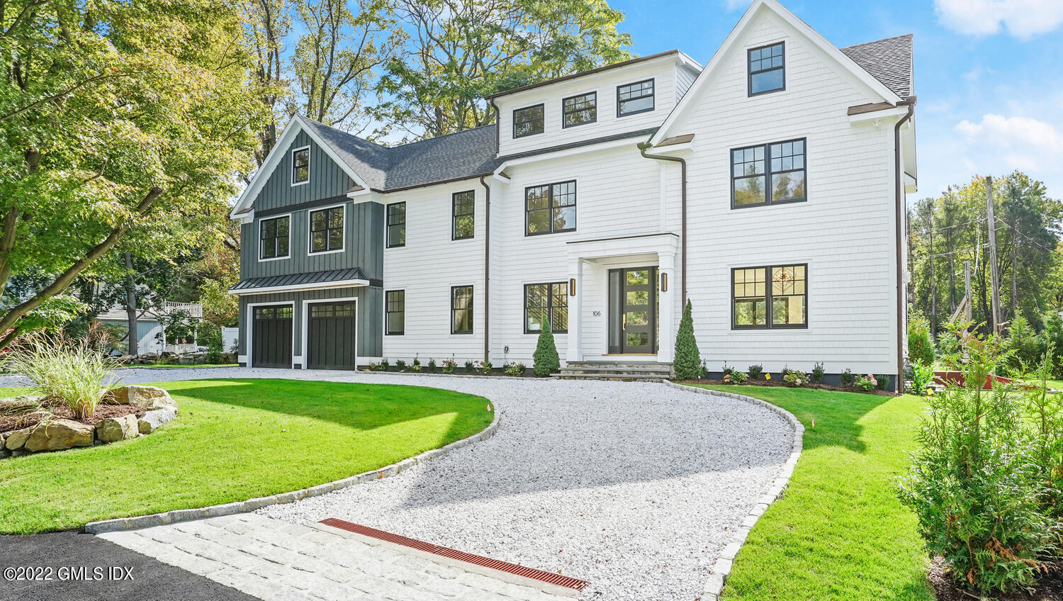 106 Sheep Hill Road Riverside, CT 06878 - Photo 3 of 53 a front view of a house with a yard and trees