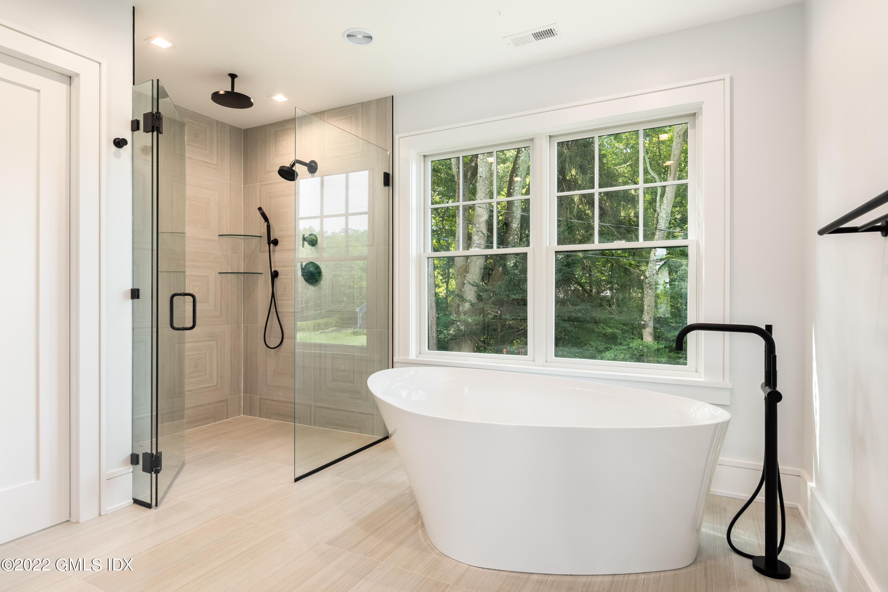 106 Sheep Hill Road Riverside, CT 06878 - Photo 32 of 53 a white bath tub sitting next to a shower