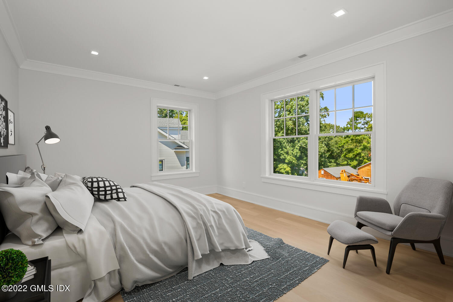 106 Sheep Hill Road Riverside, CT 06878 - Photo 38 of 53 a bedroom with a bed and wooden floor