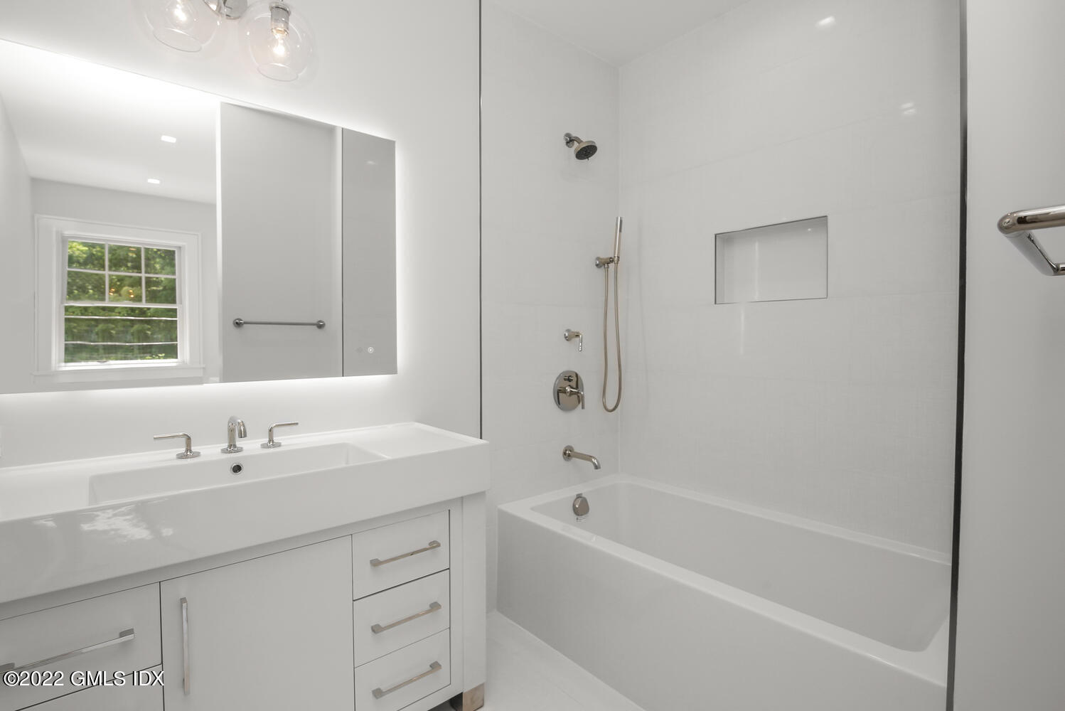 106 Sheep Hill Road Riverside, CT 06878 - Photo 40 of 53 a bathroom with a tub sink and a mirror