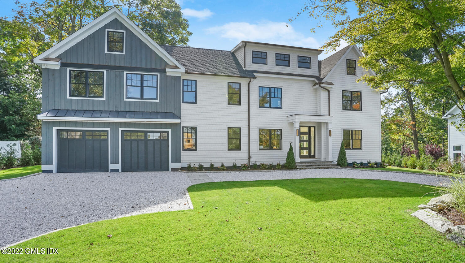 106 Sheep Hill Road Riverside, CT 06878 - Photo 4 of 53 a front view of a house with a yard