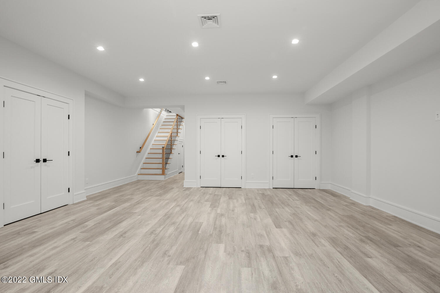 106 Sheep Hill Road Riverside, CT 06878 - Photo 49 of 53 a view of room with wooden floor and white walls