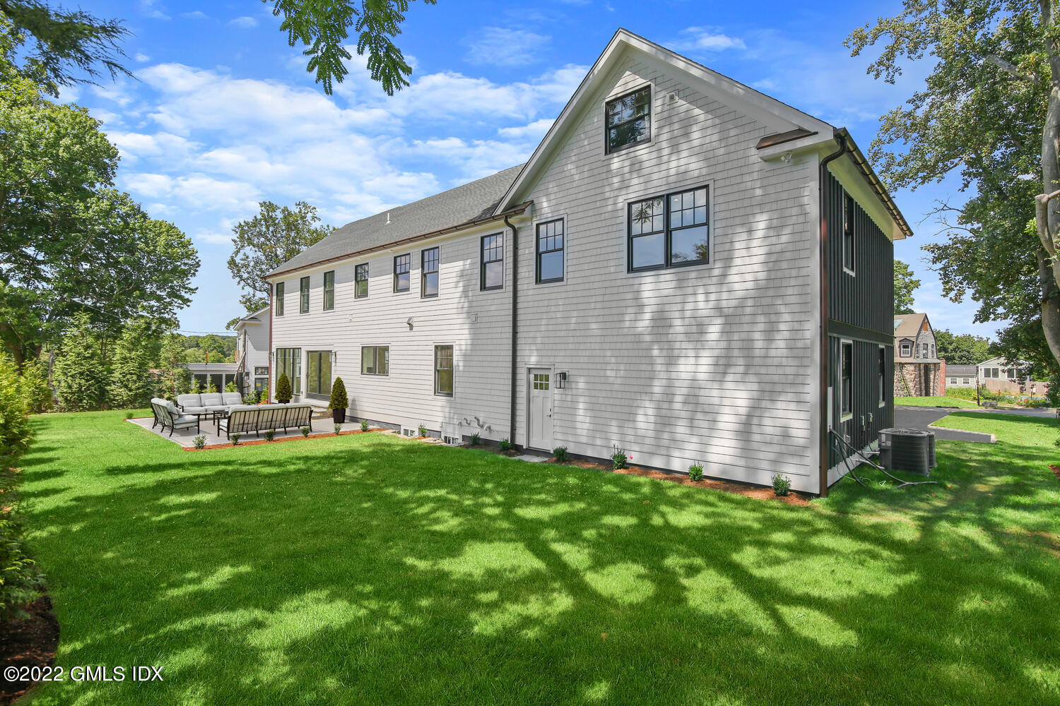 106 Sheep Hill Road Riverside, CT 06878 - Photo 5 of 53 a front view of a house with a yard