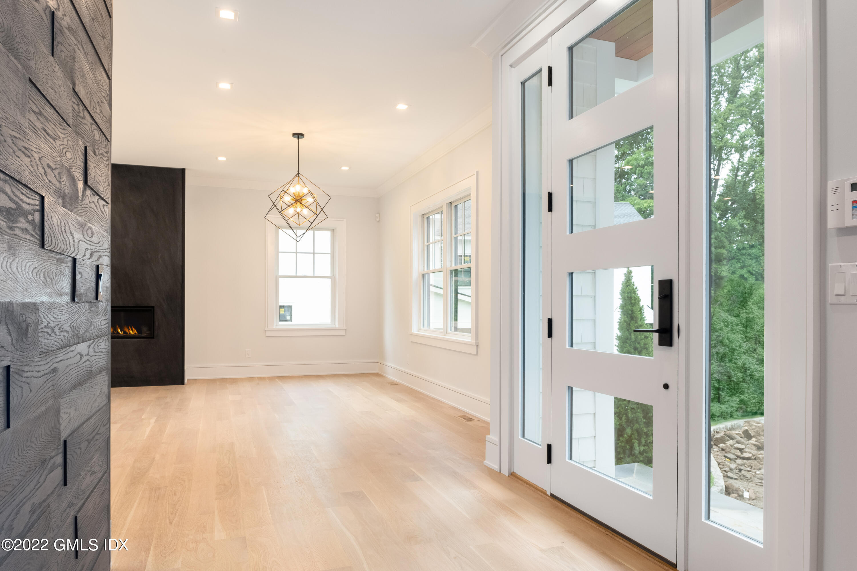 106 Sheep Hill Road Riverside, CT 06878 - Photo 8 of 53 a view of an entryway with wooden floor and windows