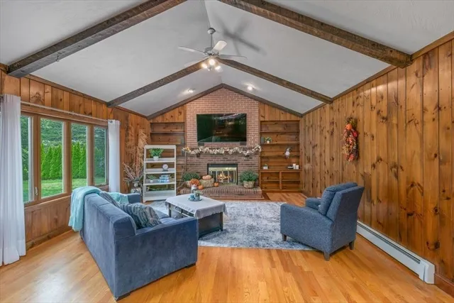 a dining room with furniture a chandelier and a rug