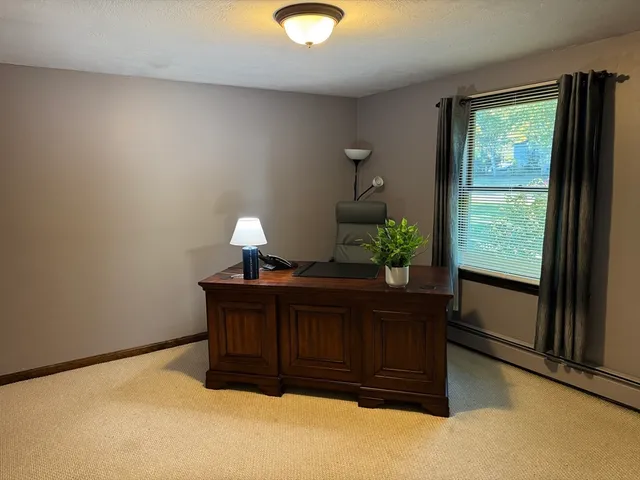 a bedroom with a bed and a television