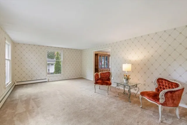 a bedroom with a bed and a chair