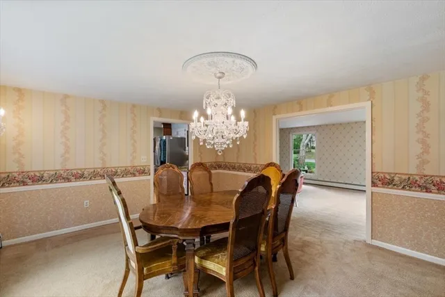 a front view of a house with a yard and green space