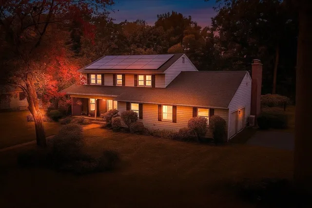 a spacious bathroom with a granite countertop sink and a mirror
