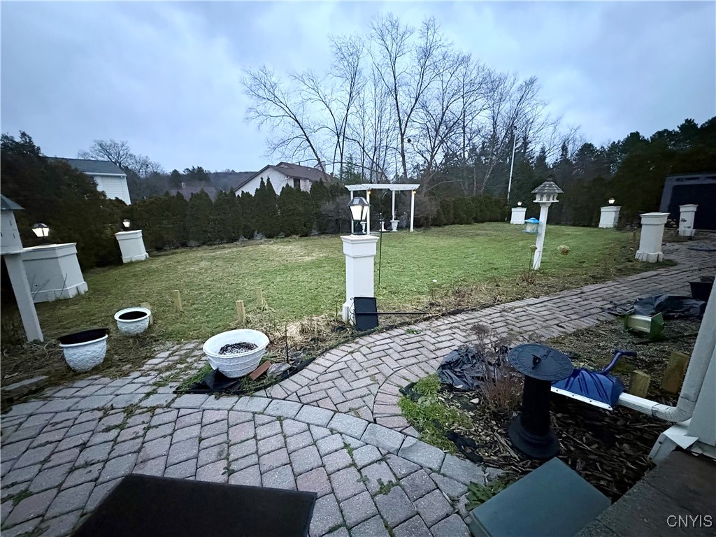 104 Old Lyme Road DeWitt, NY 13224 - Photo 31 of 34 Two paver patios linked by a pathway across the le