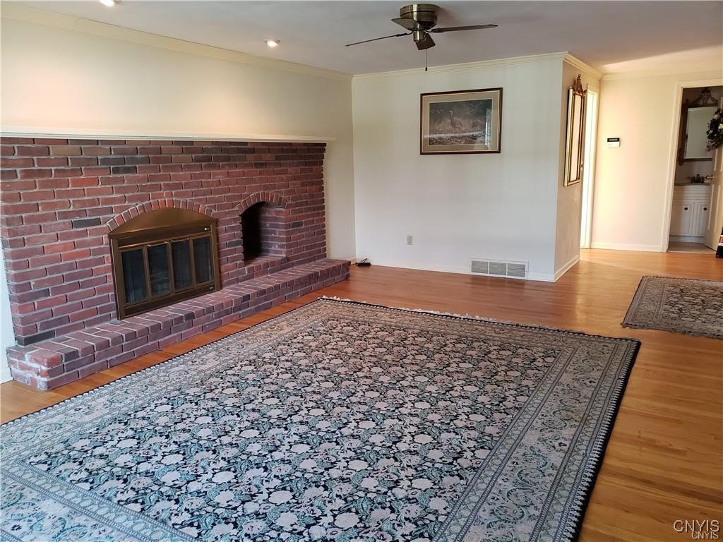 104 Old Lyme Road DeWitt, NY 13224 - Photo 9 of 34 Fireplaced family room - laundry/mudroom is left o