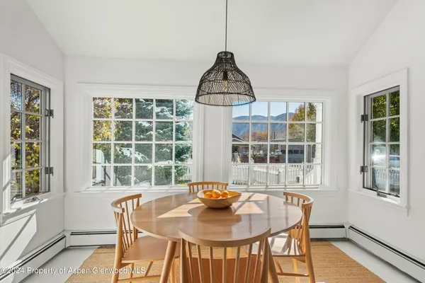 a view of a dining room with furniture window and outside view
