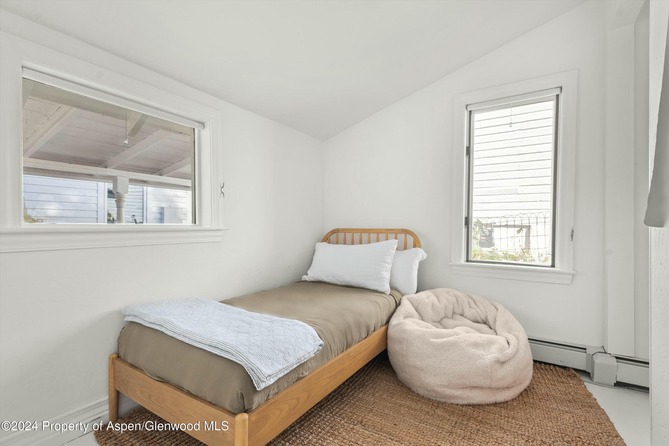 120 East Sopris Drive Basalt, CO 81621 - Photo 12 of 30 a bedroom with a bed and a window