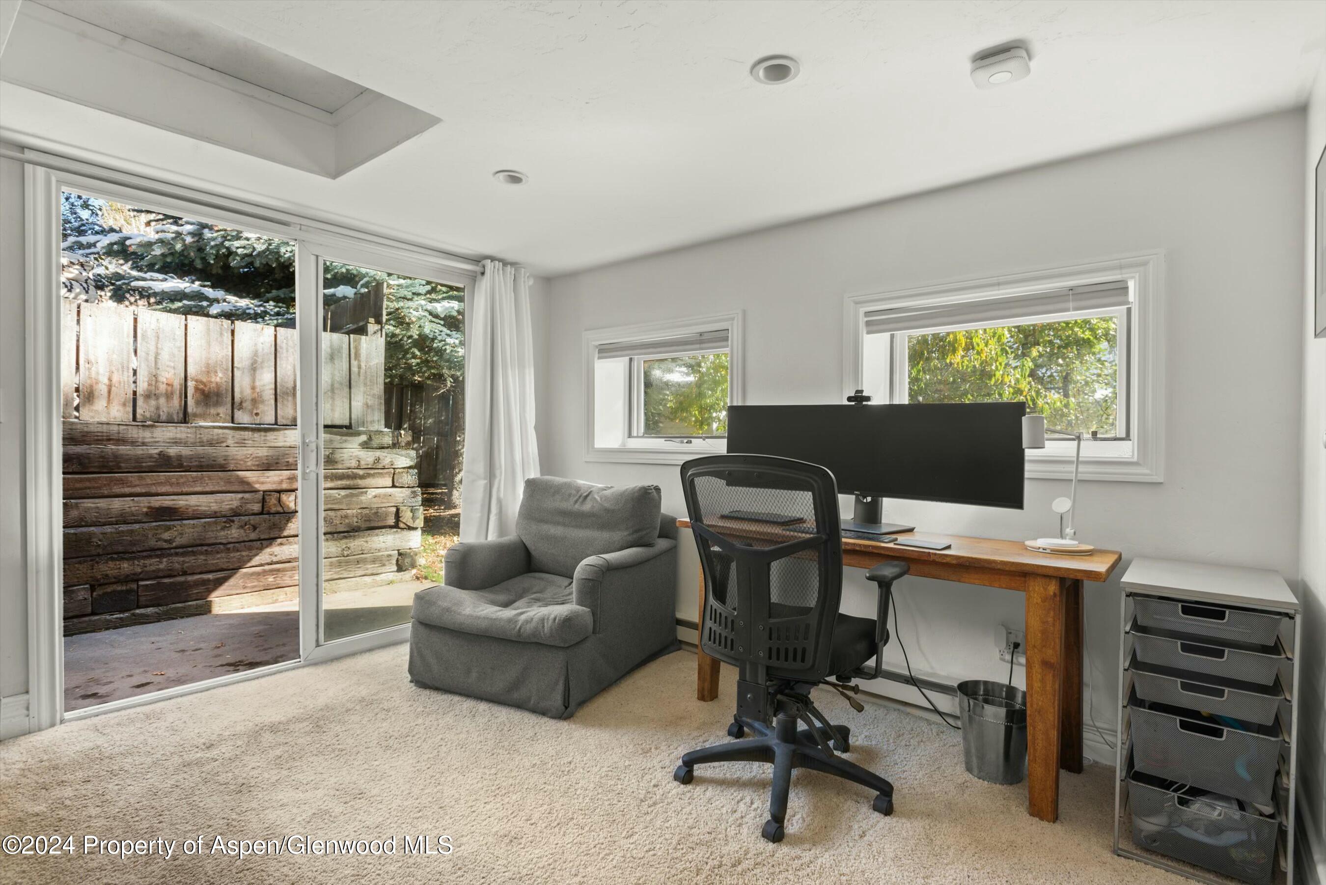 120 East Sopris Drive Basalt, CO 81621 - Photo 28 of 30 a view of a livingroom with workspace and a window