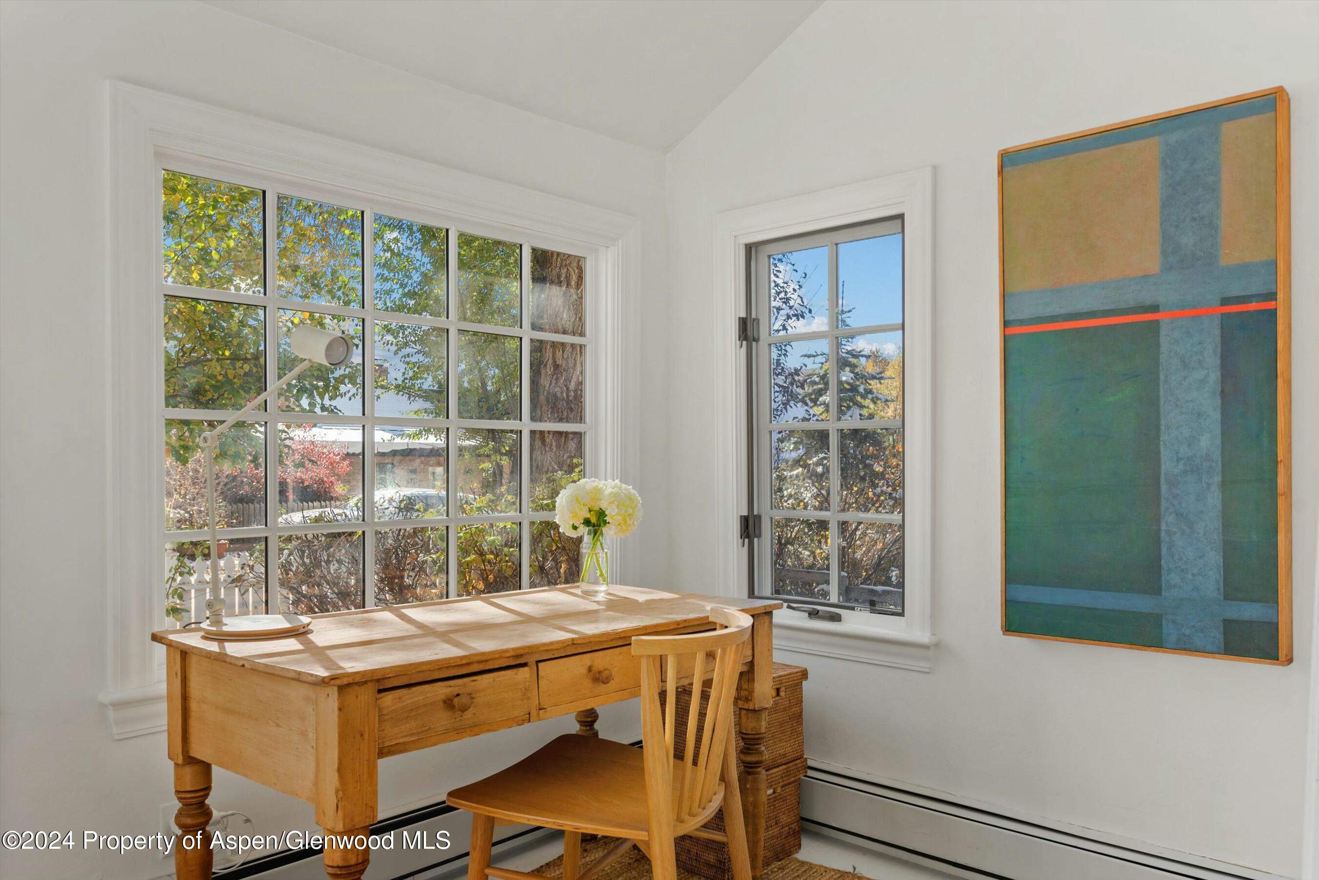 120 East Sopris Drive Basalt, CO 81621 - Photo 3 of 30 a dining room with a window and a table