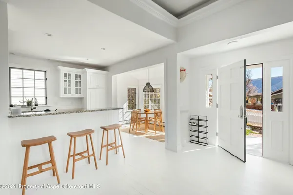 a view of kitchen with furniture and window