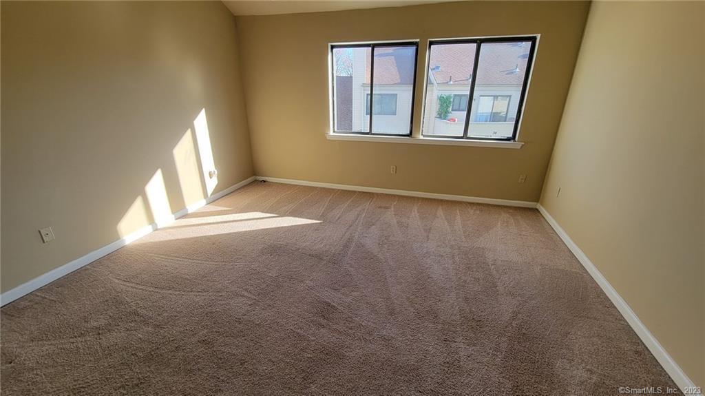 21 Deer Run, Unit 21 Bethel, CT 06801 - Photo 12 of 16 an empty room with windows