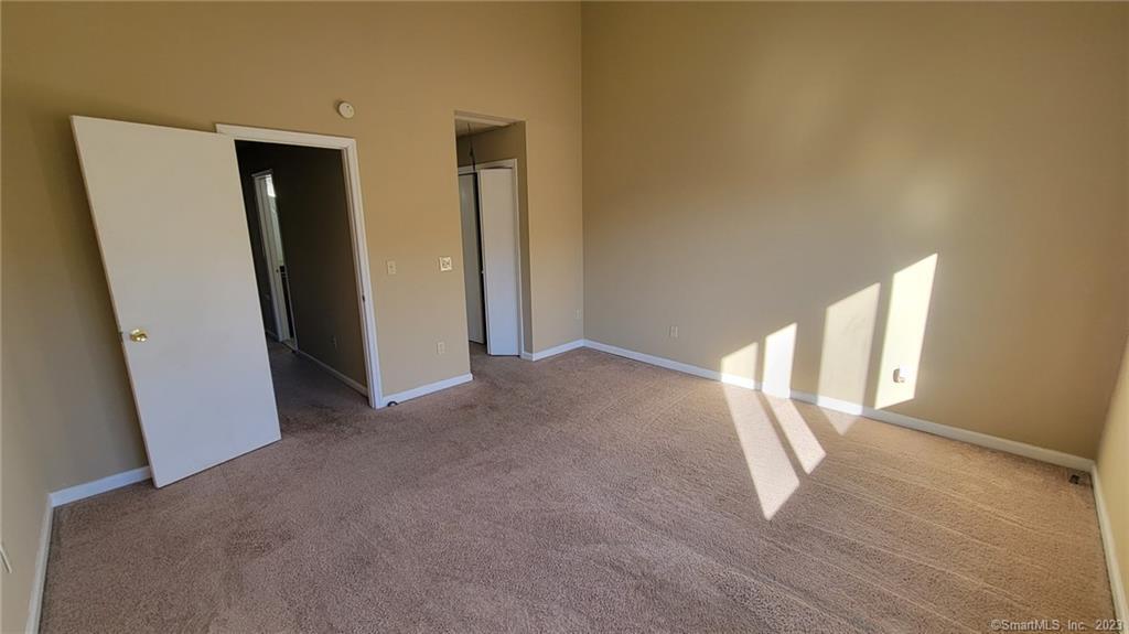 21 Deer Run, Unit 21 Bethel, CT 06801 - Photo 14 of 16 an empty room with windows and closet