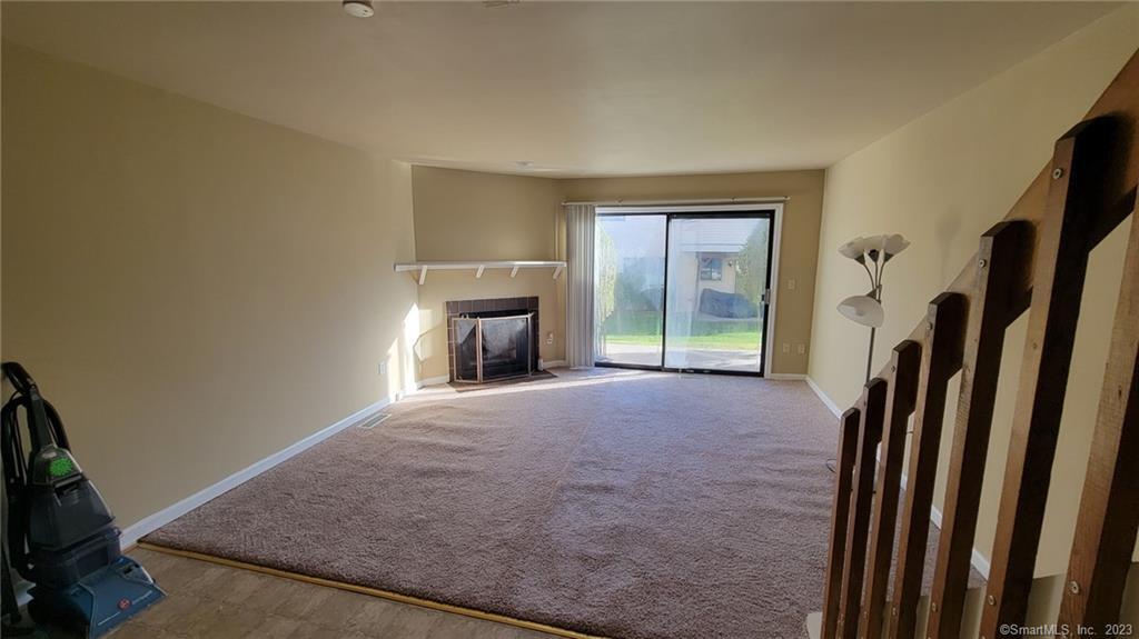 21 Deer Run, Unit 21 Bethel, CT 06801 - Photo 3 of 16 a view of empty room with a fireplace